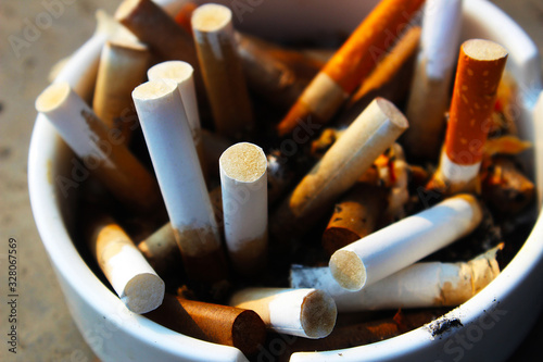 Quadro em tela Many cigarette fag ends in the ashtray