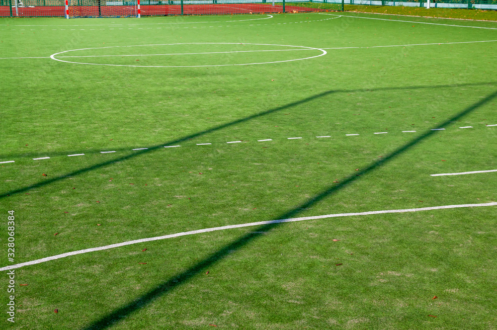 Obraz premium Closeup of green grass surface on soccer court