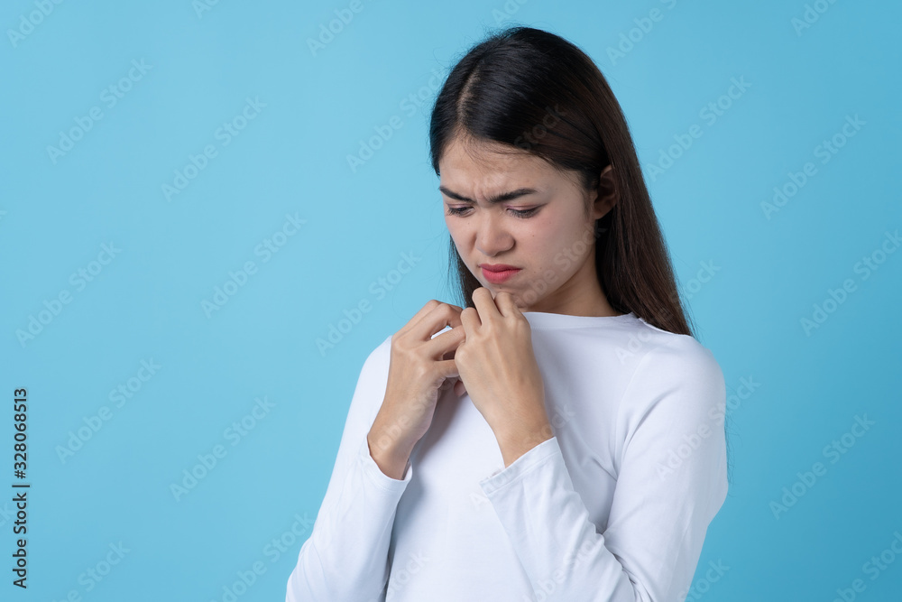 Woman smelling bad from her shirt because dirty laundry. Woman smelling bad from her shirt because dirty laundry.