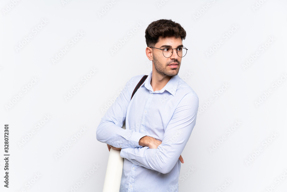 Young architect man over isolated white background laughing Young architect man over isolated white background laughing