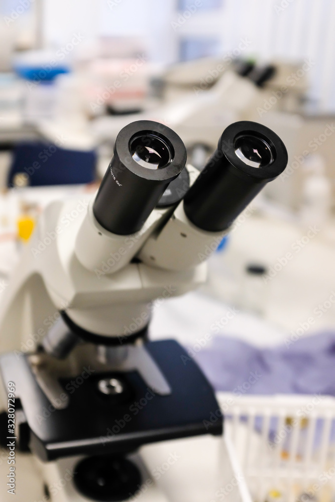 Close-up shot of microscope with metal lens at laboratory. Chemistry and science research concept background. Close-up shot of microscope with metal lens at laboratory. Chemistry and science research concept background.