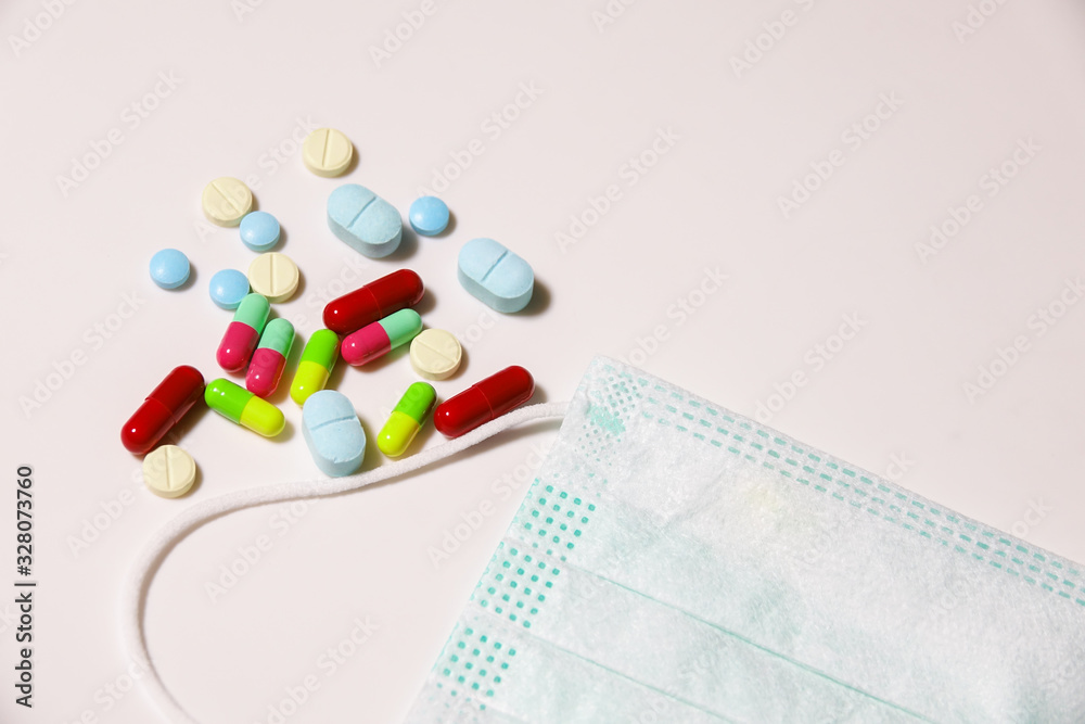 Colorful medicine with green mask on white background. Corona virus concept. Colorful medicine with green mask on white background. Corona virus concept.