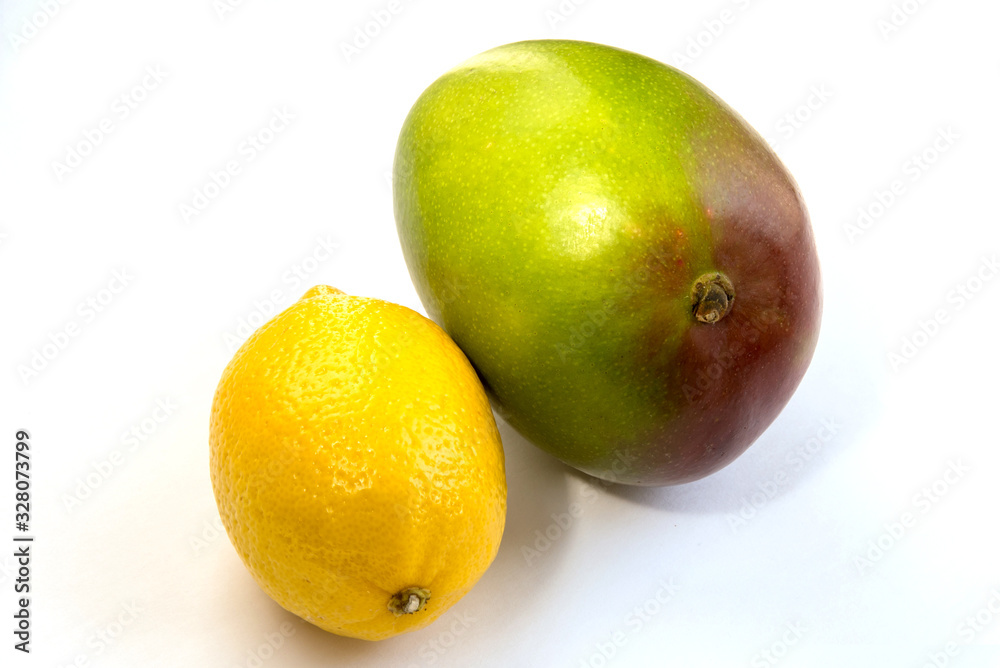 Mango, lemon on a white background, isolated, close-up, space for text Mango, lemon on a white background, isolated, close-up, space for text