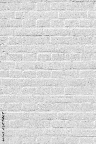 White painted brick wall with some relief background texture