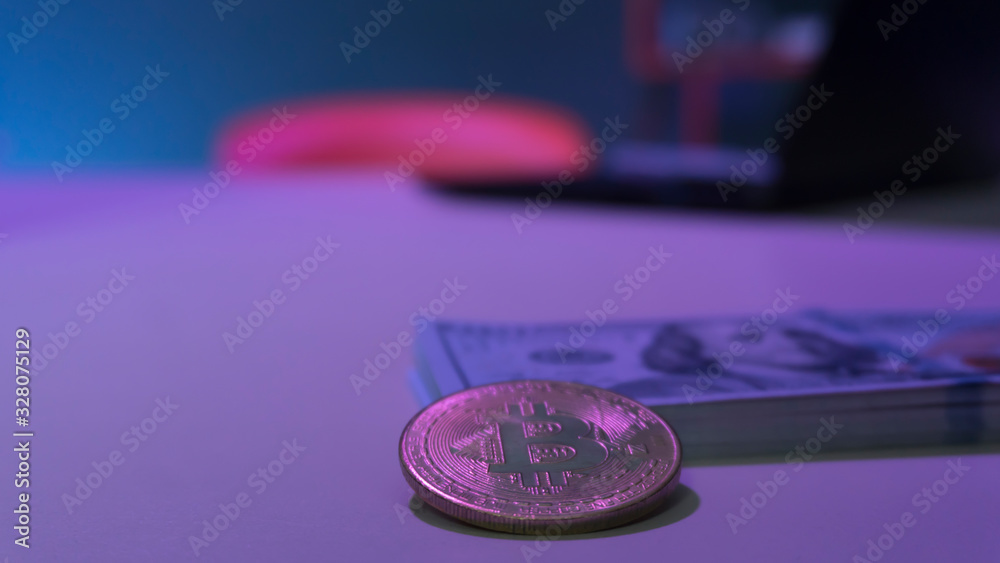 Bitcoin coins and dollars on the table Bitcoin coins and dollars on the table