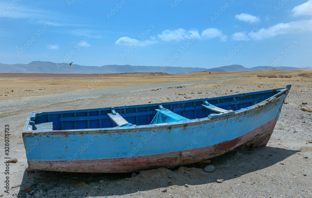 Naklejka premium Paracas. Peru. Boat in the desert.