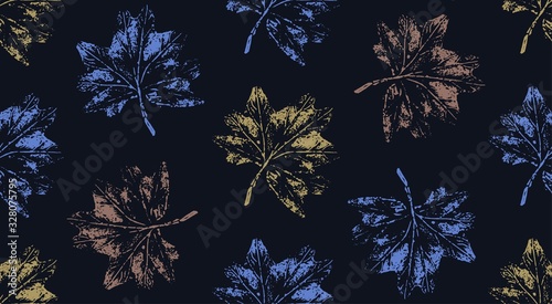 Seamless pattern with scattered leaf prints on a dark background. Universal base for packaging, flyers and postcards