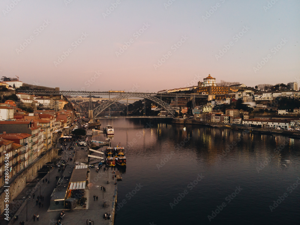 Porto, Portugal; March 4 2020: Aerial view of Porto at sunset with Dom Luis I Bridge and Douro river