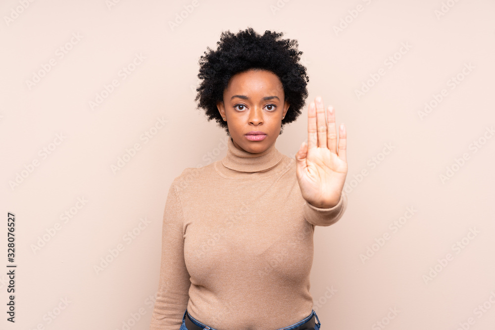 African american woman over isolated background making stop gesture African american woman over isolated background making stop gesture