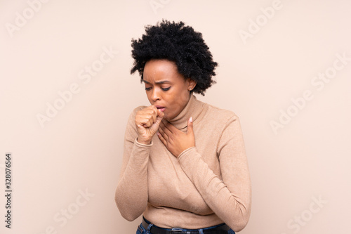 Fotografie, Obraz African american woman over isolated background is suffering with cough and feel
