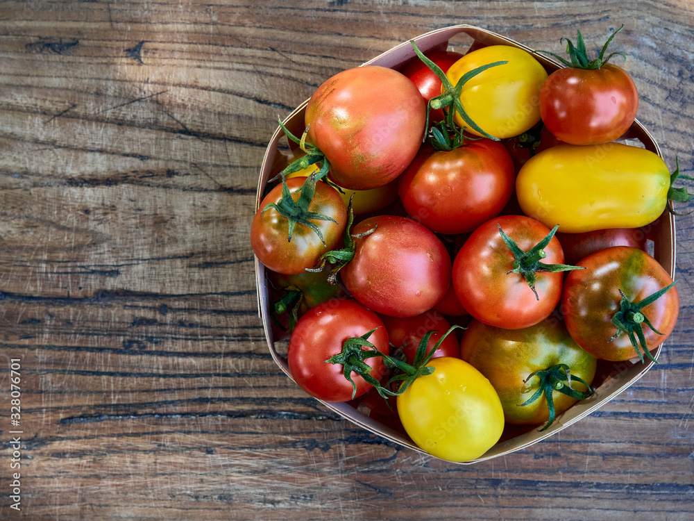 Fresh ripe tomatoes on wooden background. Fresh ripe tomatoes on wooden background.