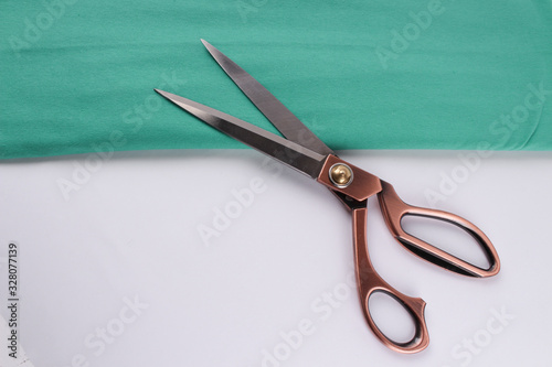 Foto scissors and canvas fabric on a white background