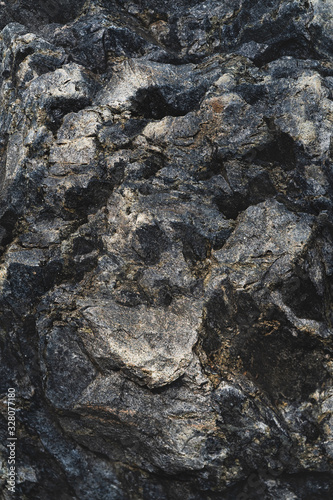 The relief texture of a large dark stone