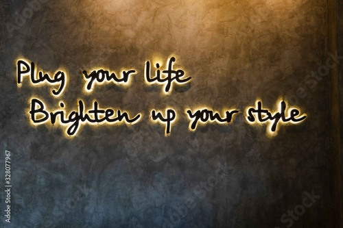 Play your life Brighten up your style - neon sign typography logo for template decoration on the wall background.  on Loft style concrete wall.
