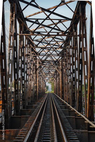 Internal view of the vintage   Metal railway bridge. in evening at Chulalongkorn Bridge Thailand. Perspective image background.