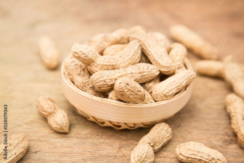 A pile of peanuts in a bamboo basket A pile of peanuts in a bamboo basket