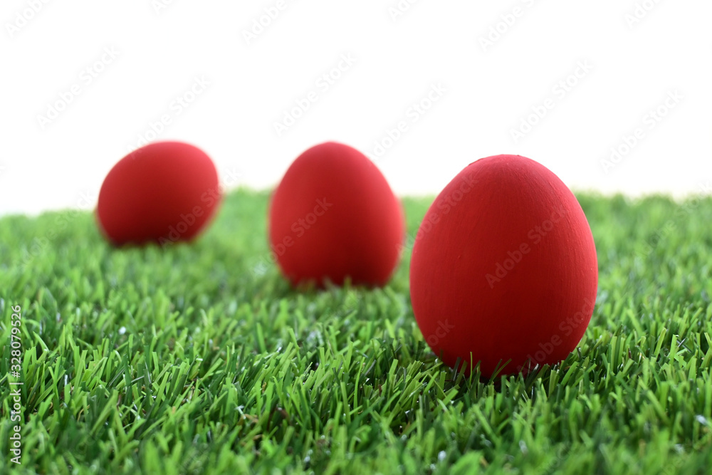 red easter egg on lawn green grass artificial with blank white background