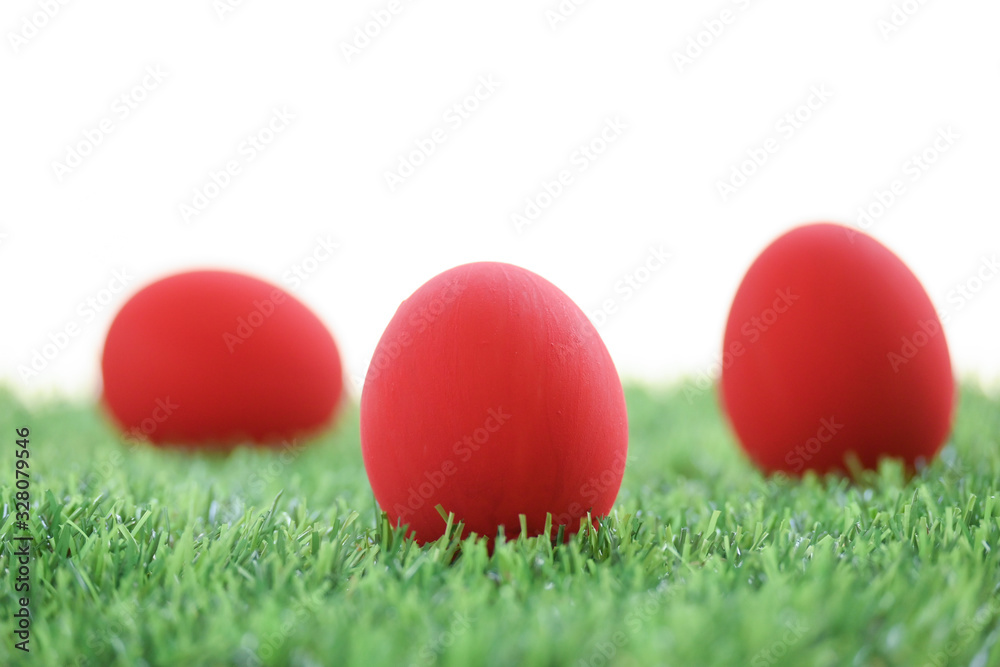 red easter egg on lawn green grass artificial with blank white background red easter egg on lawn green grass artificial with blank white background
