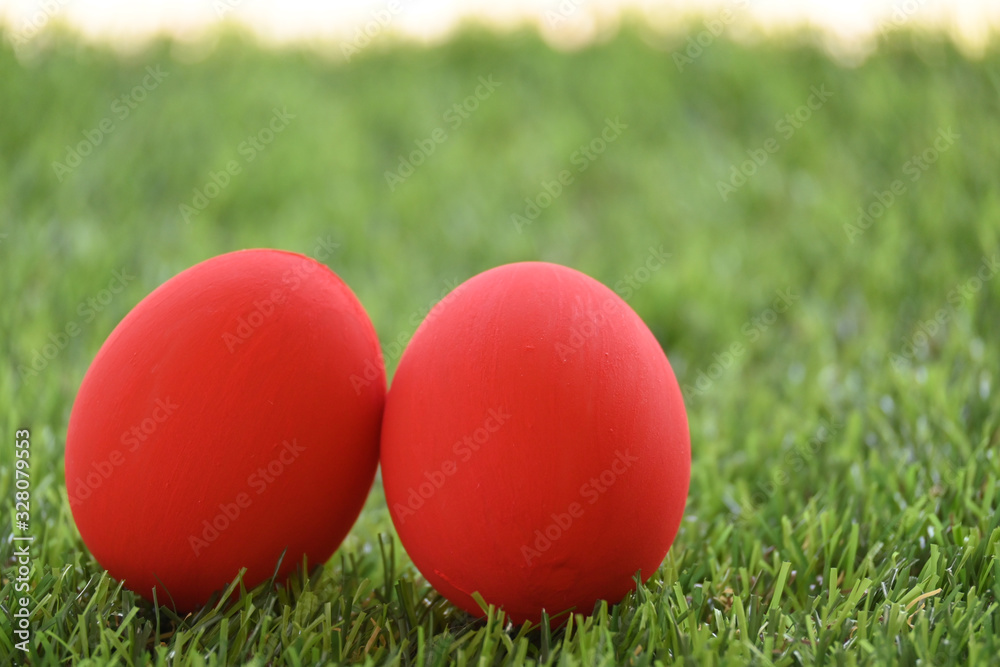 red easter egg on lawn green grass artificial, image of morning springtime concept