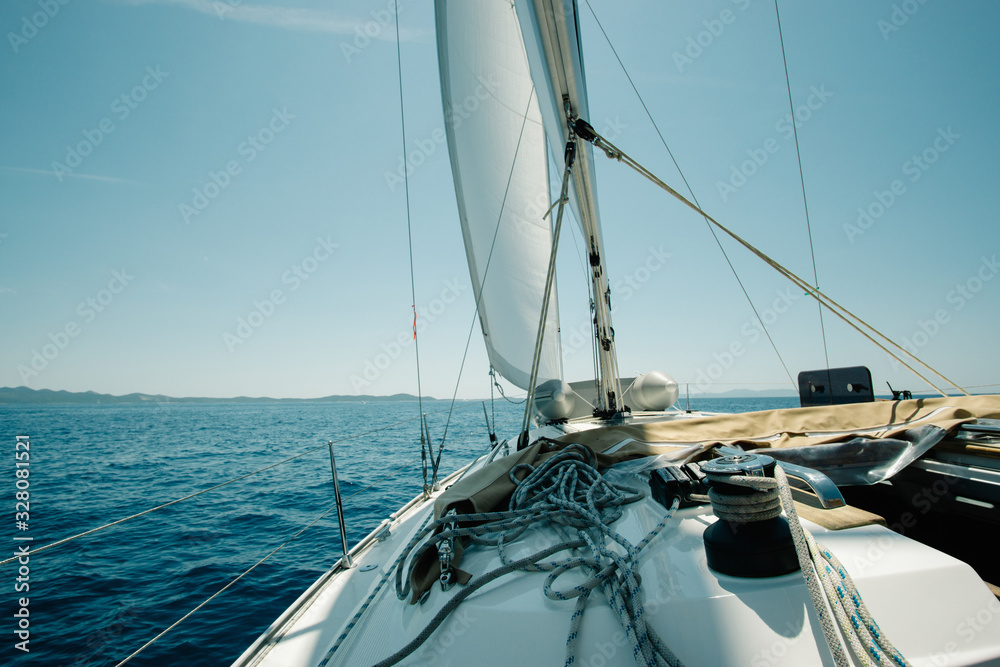 Fototapeta premium Ship deck on a yacht on the sea with blue sky. Sailing and yachting concept.