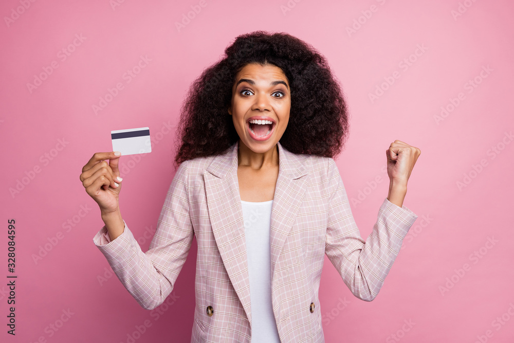 Photo of beautiful crazy dark skin business lady hold plastic wireless credit card save money not use cash currency rich person wear checkered blazer isolated pink pastel color background Photo of beautiful crazy dark skin business lady hold plastic wireless credit card save money not use cash currency rich person wear checkered blazer isolated pink pastel color background