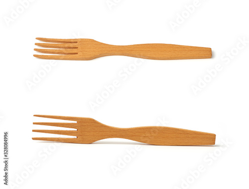 wooden yellow fork isolated on white background, vintage appliance