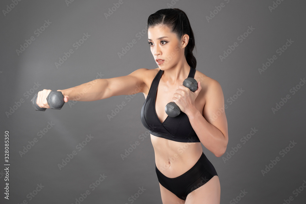 Beautiful fitness body builder woman in Studio Beautiful fitness body builder woman in Studio