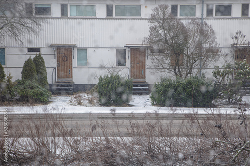 Drops on the window. On the street it is snowing heavily. March 4. Finland Espoo