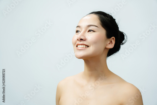 Portrait nude young Asian woman Close up of beautiful faces Feel Happy. Smile with a healthy white teeth.