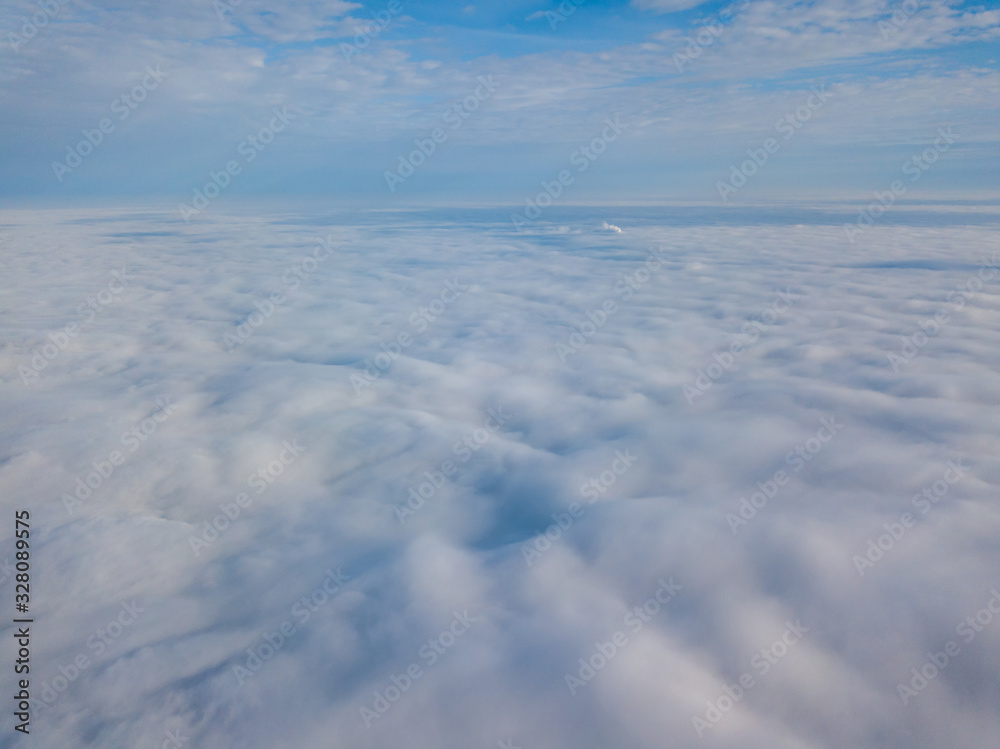 Drone flying above the clouds