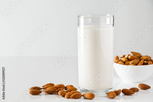 Super Food - A glass of almond milk for a healthy diet. Trending food, vertical photo. Place for your text.