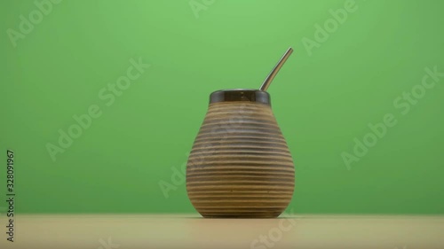 healthy yerba matte bombilla on green screen background slide to the right photo