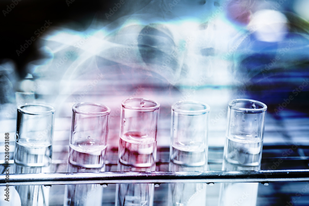 Double exposure test-tube coronavirus analysis concept in laboratory. Double exposure test-tube coronavirus analysis concept in laboratory.