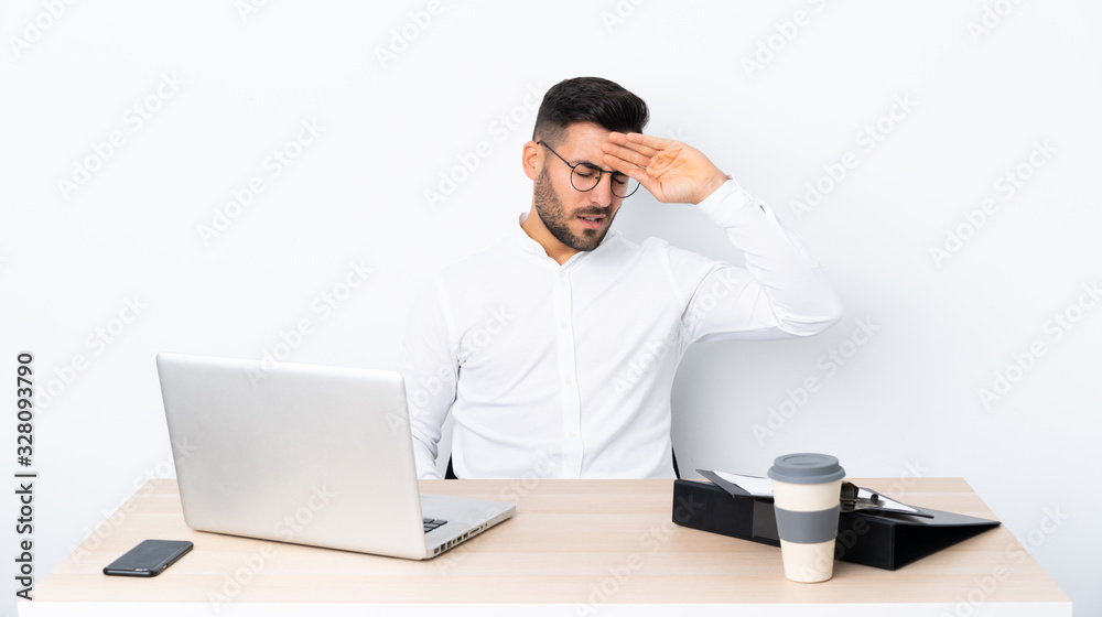 Young businessman in a workplace with tired and sick expression Young businessman in a workplace with tired and sick expression