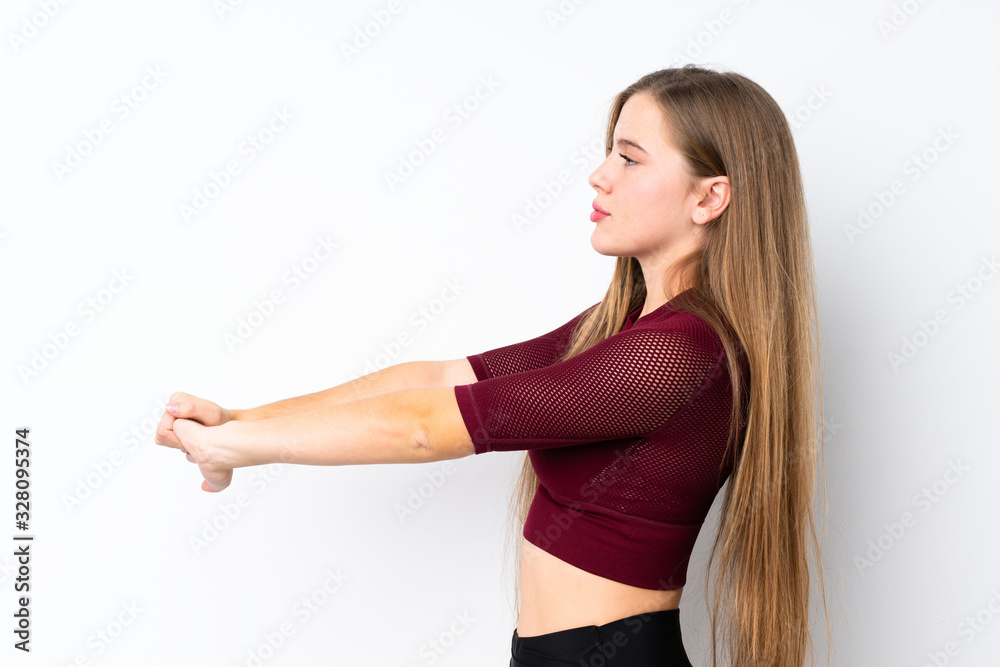 Sport teenager girl over isolated white background stretching Sport teenager girl over isolated white background stretching