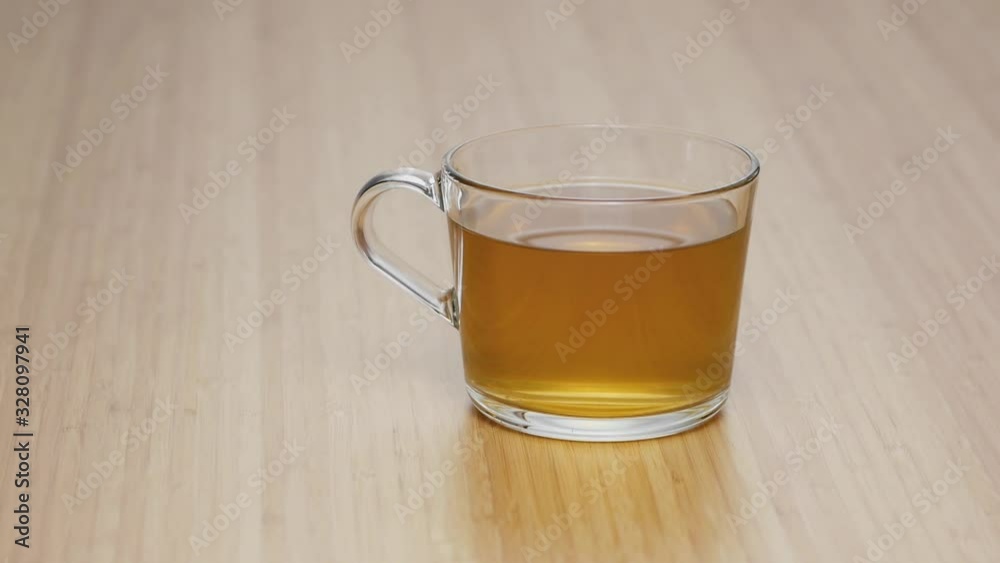 lemon balm melissa green tea on wooden table slide to the right lemon balm melissa green tea on wooden table slide to the right