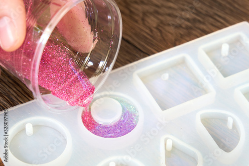 Pouring glitter pink resin mold , process of prepare for make an accessories photo
