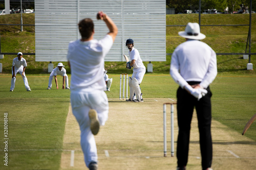 Cricket players training on the pitch