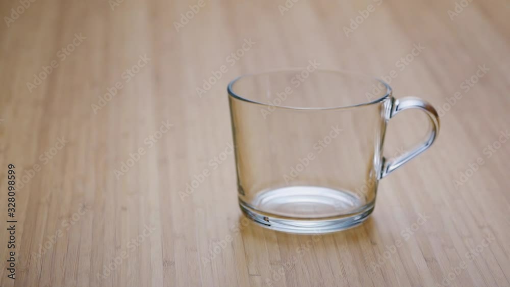 empty transparent glass on wooden table slide to the right empty transparent glass on wooden table slide to the right