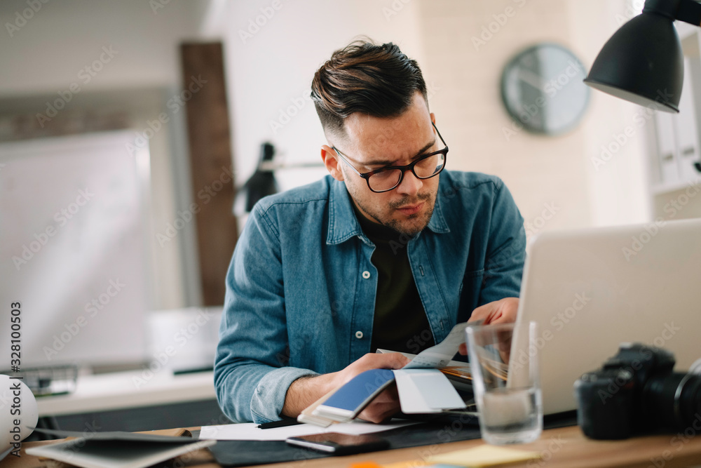 Designer in office. Businessman working on new architect project. Designer in office. Businessman working on new architect project.