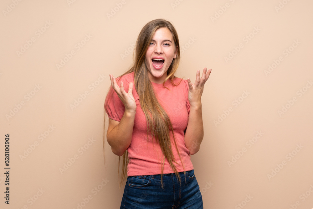Teenager blonde girl over isolated background unhappy and frustrated with something Teenager blonde girl over isolated background unhappy and frustrated with something