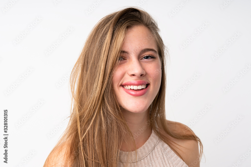 Portrait of beautiful teenager blonde girl over isolated white background Portrait of beautiful teenager blonde girl over isolated white background