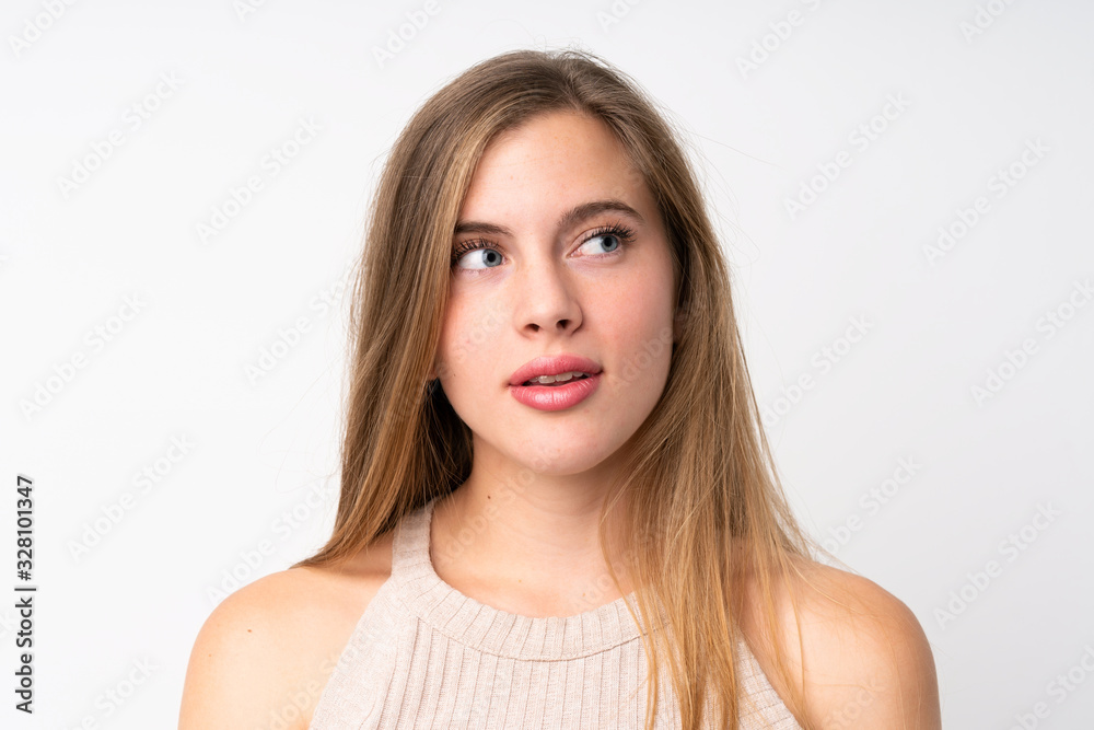 Portrait of beautiful teenager blonde girl over isolated white background Portrait of beautiful teenager blonde girl over isolated white background