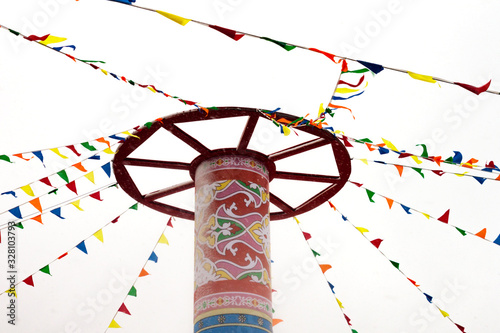 Round high post with multycolored flags Shrovetide carnival pancake week Russian holiday Maslenitsa concept photo