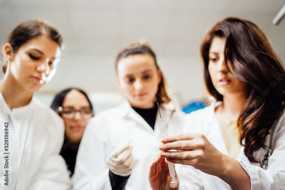 Team of pharmacists developing parenteral antibody antivirus.New vaccine patent.Pharmaceutical pre-clinic formulation development.Antibiotic safety control test examination.Virus epidemic concept Team of pharmacists developing parenteral antibody antivirus.New vaccine patent.Pharmaceutical pre-clinic formulation development.Antibiotic safety control test examination.Virus epidemic concept
