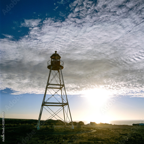 A lighthouse is a tower, designed to emit light from a system of lamps and lenses and to serve as a navigational aid for sea pilots at sea or on waterways.