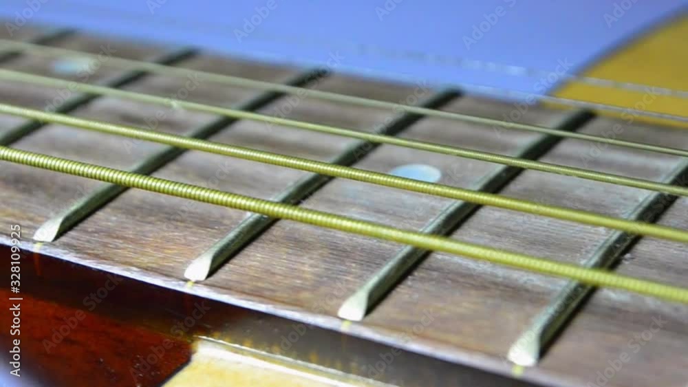 Instrument music. fret-board of acoustic guitar. Left side camera movement Instrument music. fret-board of acoustic guitar. Left side camera movement