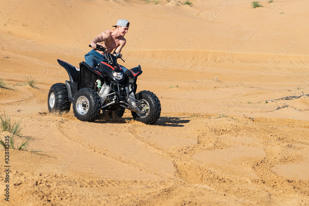 Muscular Man topless Riding Atv In the Desert Muscular Man topless Riding Atv In the Desert