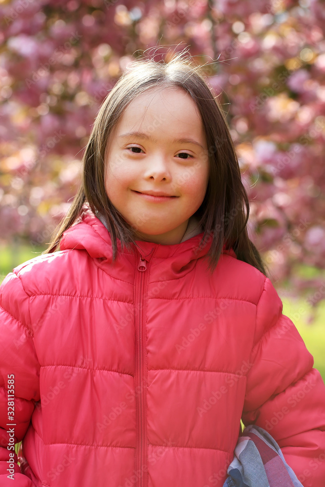 Girl in the park of blooming sakura Girl in the park of blooming sakura