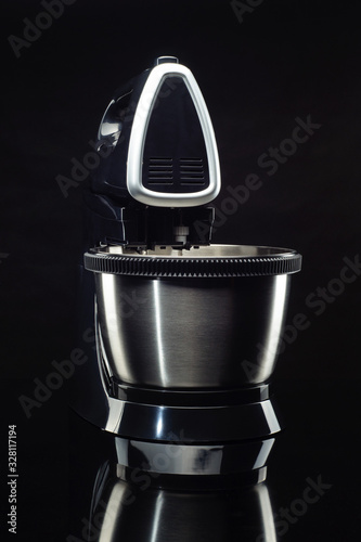 Electrical mixer on the black background